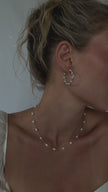 Bride wearing WAAWEES water-resistant gold necklace with pearl pendant, styled for wedding day.